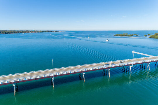 Diagonal aerial view of bridge over water.