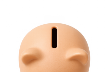 Piggy bank top view showing the coin slot, illustrating concepts of saving, investment, and financial planning