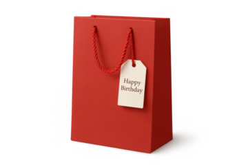 Red shopping paper bag with happy birthday gift tag presenting a holiday celebration present and surprise theme