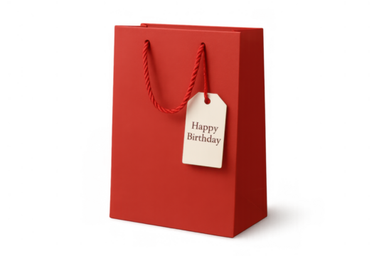 Red shopping paper bag with happy birthday gift tag presenting a holiday celebration present and surprise theme