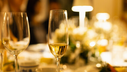 Red and white wine glasses on a beautifully set table, Fine dining and wine, Luxury table setting.