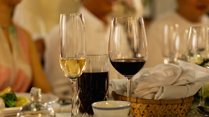 Red and white wine glasses on a beautifully set table, Fine dining and wine, Luxury table setting.