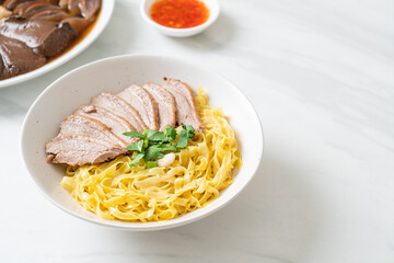 dried duck noodles in white bowl