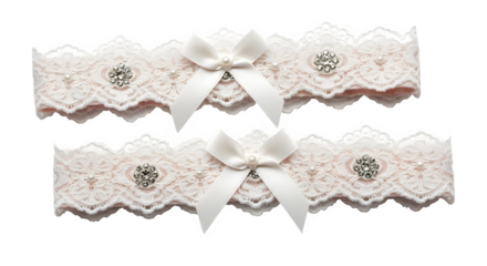 Elegant white lace wedding garters adorned with ribbons and rhinestones