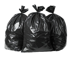 Three tied, full black plastic trash bags isolated against a dark background