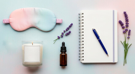 Bedtime routine and self-care flat lay with sleep mask, lavender, and aromatherapy. Relaxation concept with a lit candle and blank journal for writing
