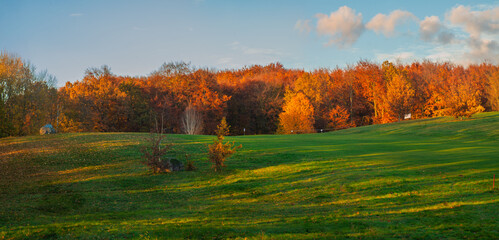 Sunset over a beautiful golf course in autumn