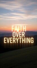 Inspirational sunset scene with the phrase 'Faith Over Everything' illuminated in bold letters against a colorful sky backdrop