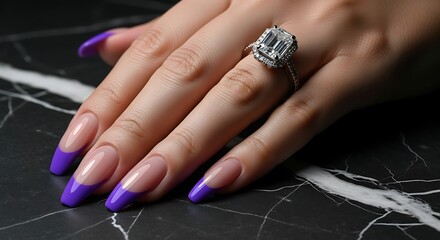 Luxury emerald cut ring on manicured hand