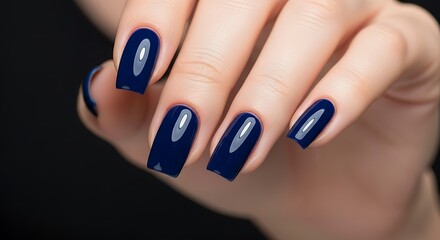 Woman's Hand Dark Blue Glossy Manicure