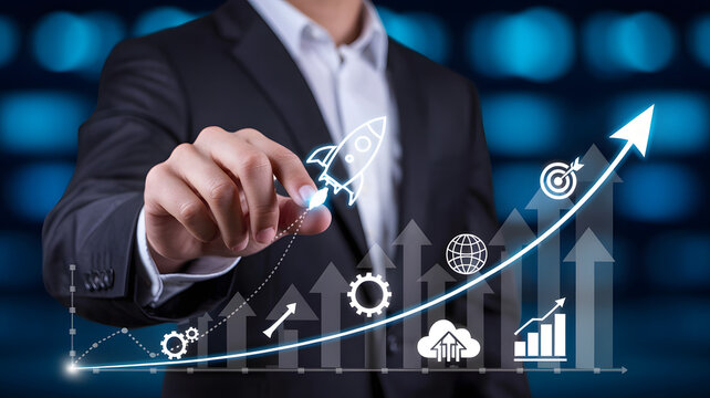 A person in a suit pointing at a rocket ship on a graph with arrows and other business icons on it