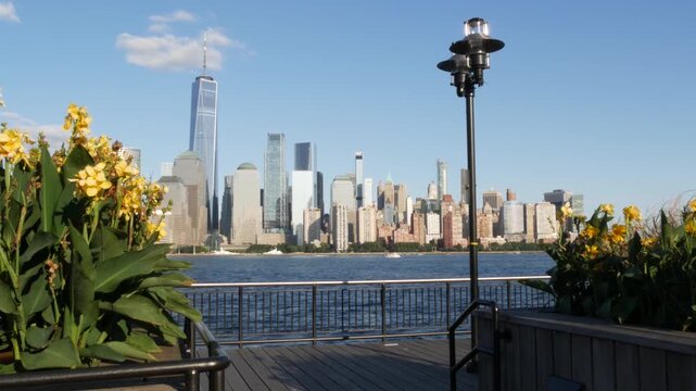 New York City Manhattan downtown financial district skyline, New Jersey Exchange Place, United States. Urban cityscape with skyscraper buildings, World Trade Center. J Owen Grundy park, Paulus Hook.