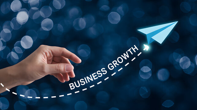 Hand launching paper airplane with business growth text on a bokeh blue background concept image - Powered by Adobe