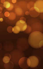 Warm abstract background with golden, orange, and brown bokeh. Soft, blurred, glittering lights for a festive, autumn, or elegant design.