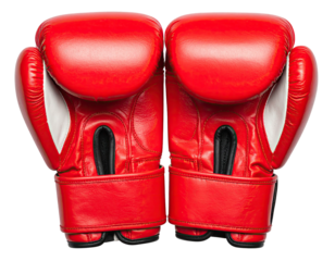 Close-up of two red leather boxing gloves side-by-side against black