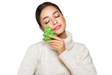 Woman in a white knitted sweater with cookie Christmas tree isolated on transparent background. Christmas or New Year festivities. Holiday and Party