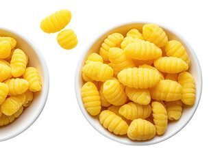 Two white bowls, brimming with yellow, ridged pasta, against a black background