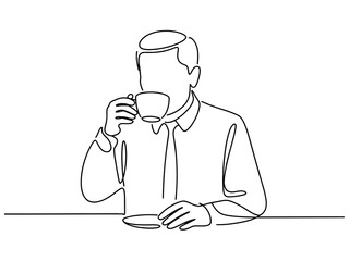 A person in a white shirt and tie sips a cup of coffee while sitting at a table.