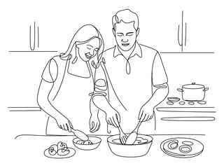 A couple is happily cooking together in a kitchen with food on the counter.