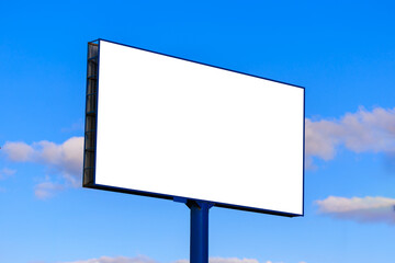 Obraz premium Advertising billboard along the road in the city on a sunny day. Background for design.