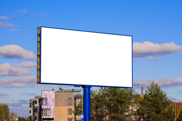 Fototapeta premium Advertising billboard along the road in the city on a sunny day. Background for design.