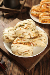 Fresh Steamed Pork Buns with Savory Filling on Rustic Wooden Table