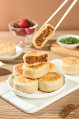 Chinese Pork Pastries with Chopsticks - Traditional Asian Dumplings with Meat Filling