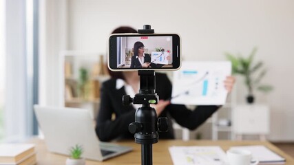 Caucasian woman recording business presentation, sharing strategies and data analysis from laptop setup - Powered by Adobe