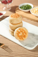 Chinese Pan-Fried Steamed Buns with Crispy Bottom and Dipping Sauces Traditional Asian Cuisine