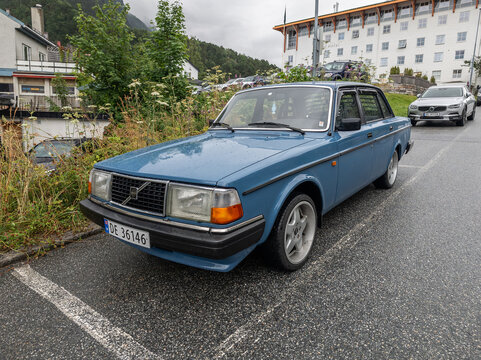 28 july 2025, Andalsnes, Norway. Blue vintage sedan car, volvo parked at the side of the road. Retro 80&rsquo;s volvo car. Elderly but reliable car from Sweden. Front view.