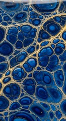 Abstract fluid art with interconnected blue and gold bubbles creating a mesmerizing pattern and textured surface