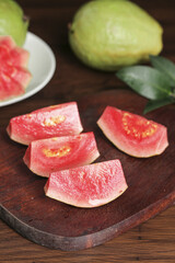 Fresh Red Guava Slices on Wooden Board - Tropical Fruit