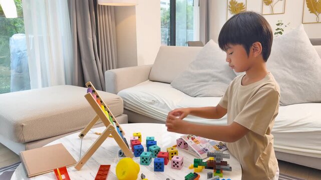 Child Playing with Math Dice in Cozy Living Room