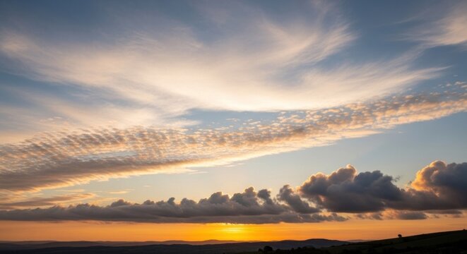 A vibrant sunset with a dramatic sky and scattered clouds, casting a warm glow over a silhouette of a hillside. - Powered by Adobe