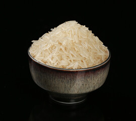 Bowl of Premium Basmati Rice Grains on Black Background - Agricultural Food Product