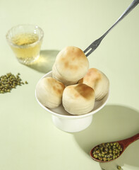 Traditional Green Bean Cake Dessert with Mung Beans and Tea - Asian Sweet Pastry