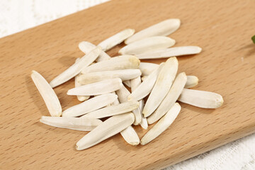 Fresh White Melon Seeds on Wooden Board - Natural Healthy Snack Ingredients Closeup