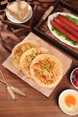 Delicious handfried Shanghai scallion pancakes with butter crispy layers and traditional Chinese breakfast spread