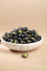 Black Beans with Green Splits in White Bowl - Healthy Legume Food Ingredient