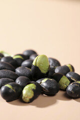 Black Beans with Green Interior Scattered on Neutral Background - Healthy Food Ingredient