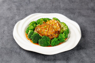 Steamed Golden Abalone with Broccoli Chinese Seafood Dish on White Plate