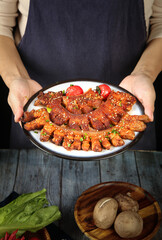 Crispy Thick Cut Roast Pork Dishes with Fresh Garnish on Rustic Wooden Table