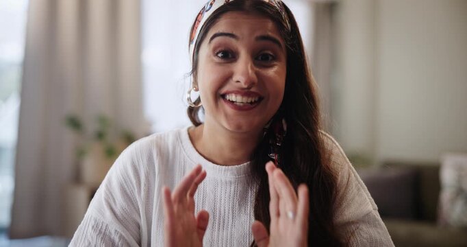 Indian woman, talking and waving with video call for communication, live streaming or lesson in living room at home. Portrait of POV of female person, vlogger or influencer in online tutorial or tips