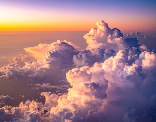 Aerial view showcases vibrant, sunlit clouds at dawn or dusk, with varying textures and colors