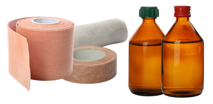 a photograph featuring rolls of elastic medical tape and gauze bandages alongside two vintage amber glass bottles containing liquid antiseptic solution.
