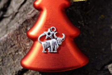 A metal bull figurine and a Christmas tree.
