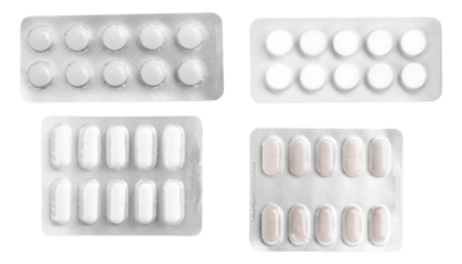 collection of four different types of white and light-colored pharmaceutical pills and capsules stored securely within silver blister packs, isolated on black.