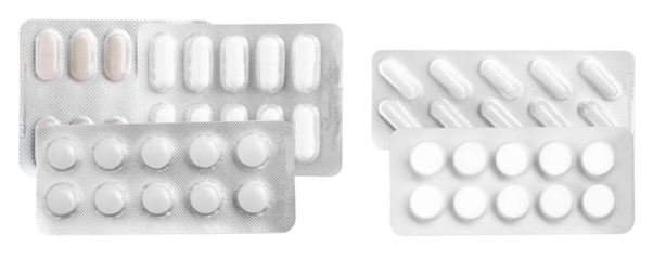 overlapping arrangement of various white and light-colored pharmaceutical tablets and capsules secured inside protective silver foil blister packaging, isolated on black.