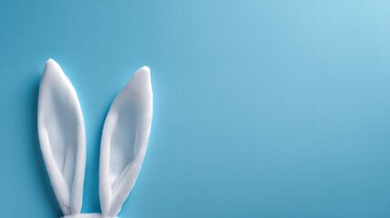 White Bunny Ears Against Light Blue Background for Cute Easter or Animal Theme Stock Photo