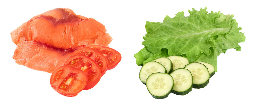 delicious stack of smoked salmon slices next to fresh salad ingredients including sliced tomatoes, crisp cucumbers, and vibrant green lettuce isolated. - Powered by Adobe